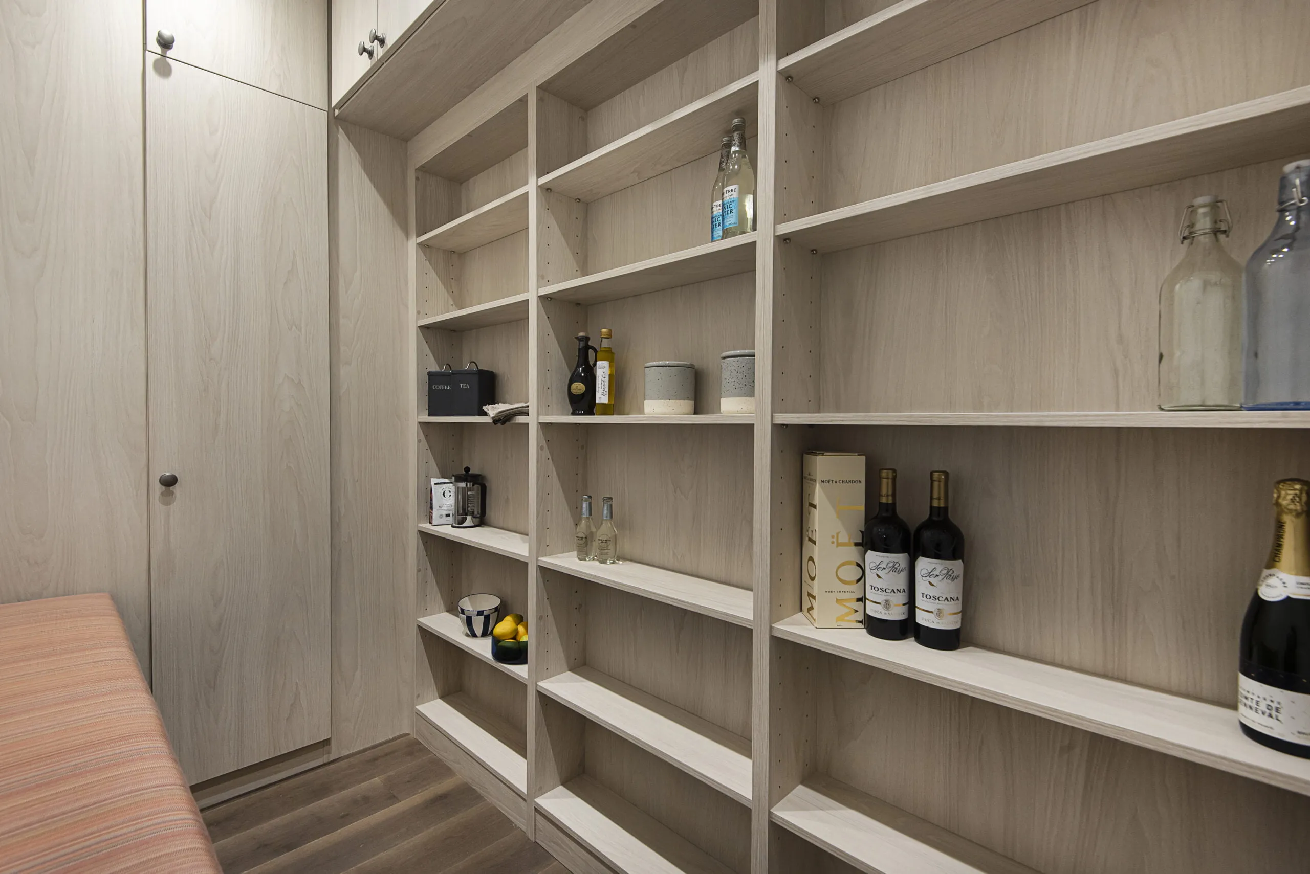 Light wooden storage solution in pantry, hand built by Deanes Wardrobes