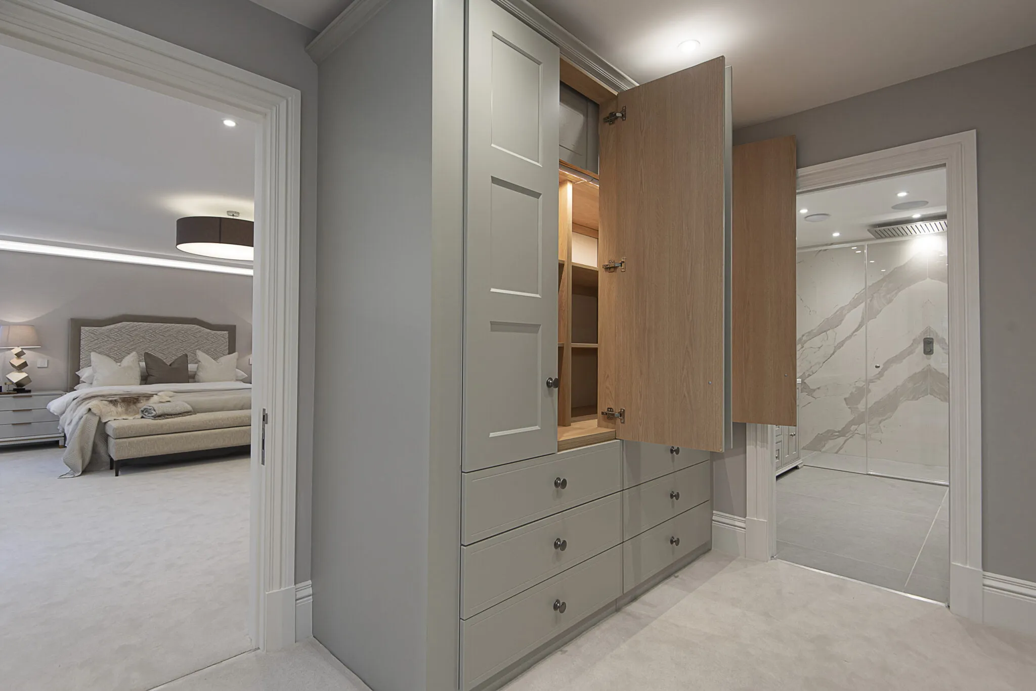 Large fitted cupboard in grey room