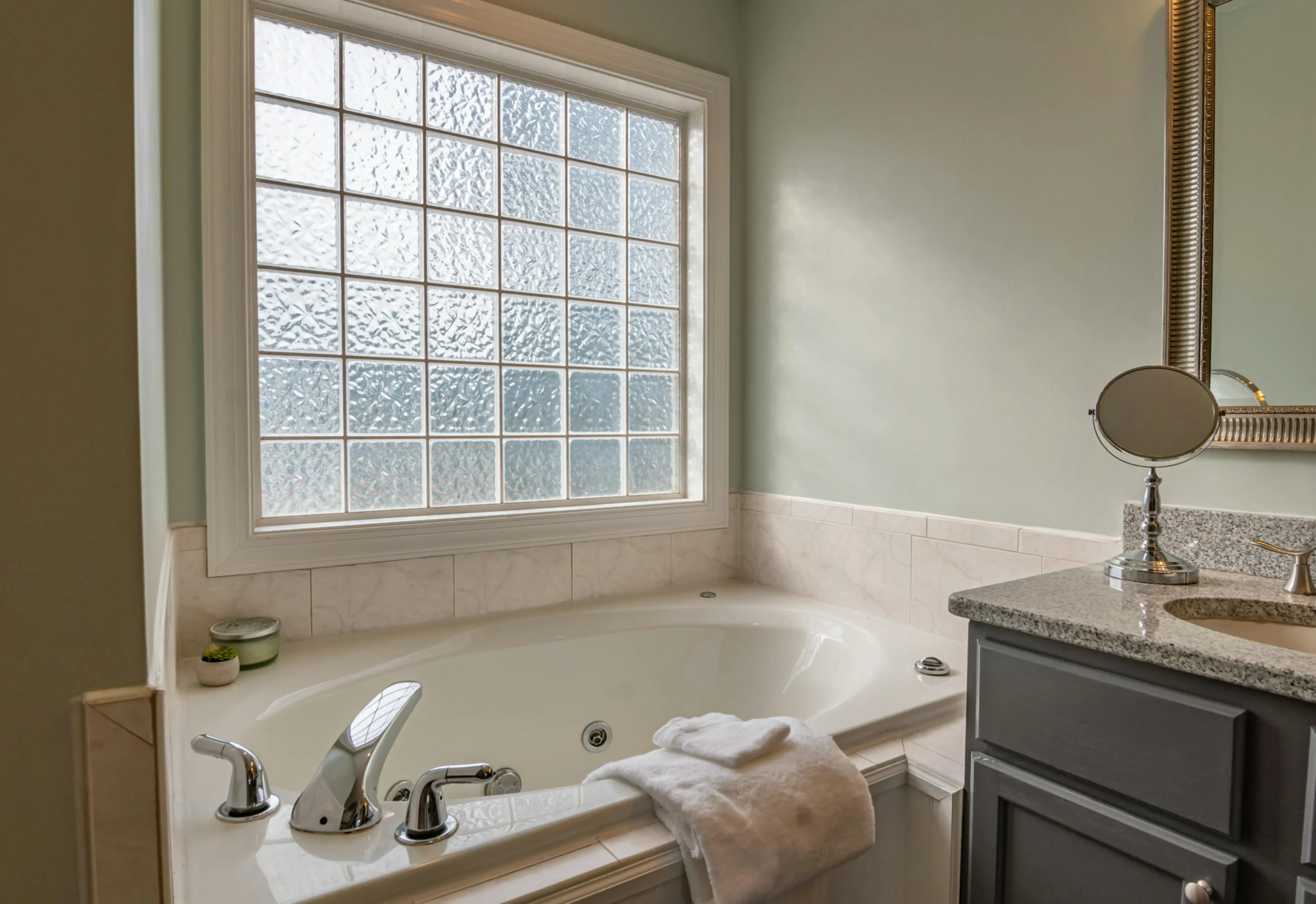 Adding Value To Your Home: Bathroom View of Bath In front of a Window