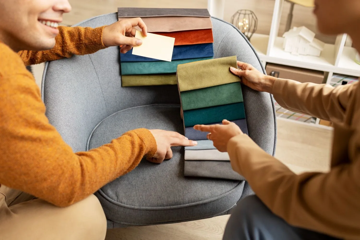 Planning a Walk-in Wardrobe: A couple looking through a variety of colour palettes together